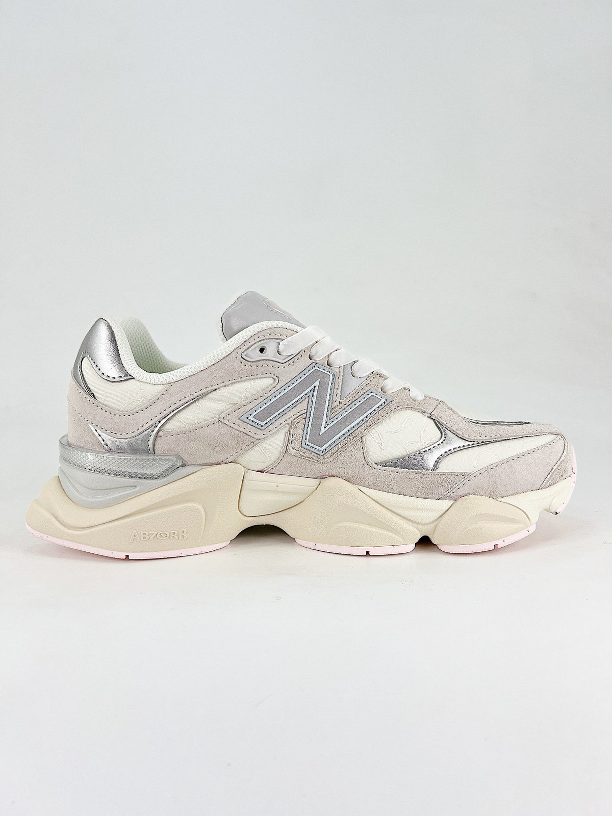New Balance 9060 sneakers, featuring a retro-futuristic design inspired by archival models like the 990 serie