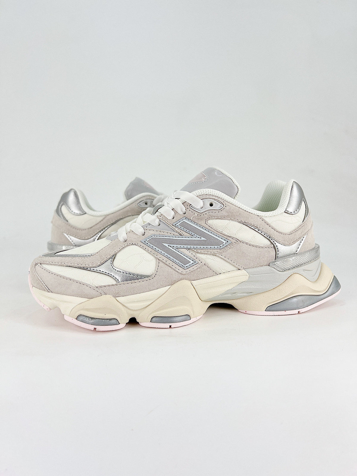 New Balance 9060 sneakers, featuring a retro-futuristic design inspired by archival models like the 990 serie
