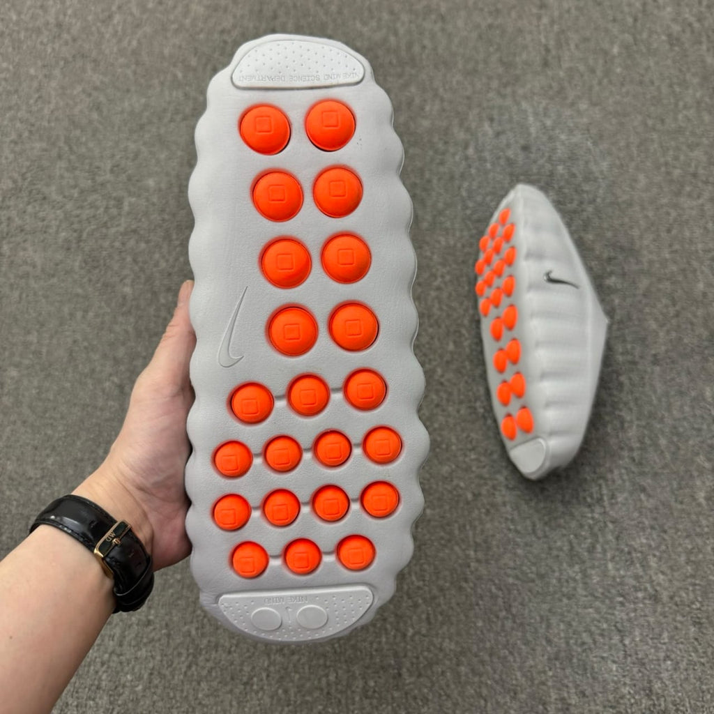 Nike Mind 001 recovery mule in the "Light Smoke Grey"