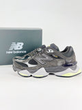 New Balance 9060 sneakers shown are in a black and cement colorway, often featuring a durable mesh and suede construction with Lime accents