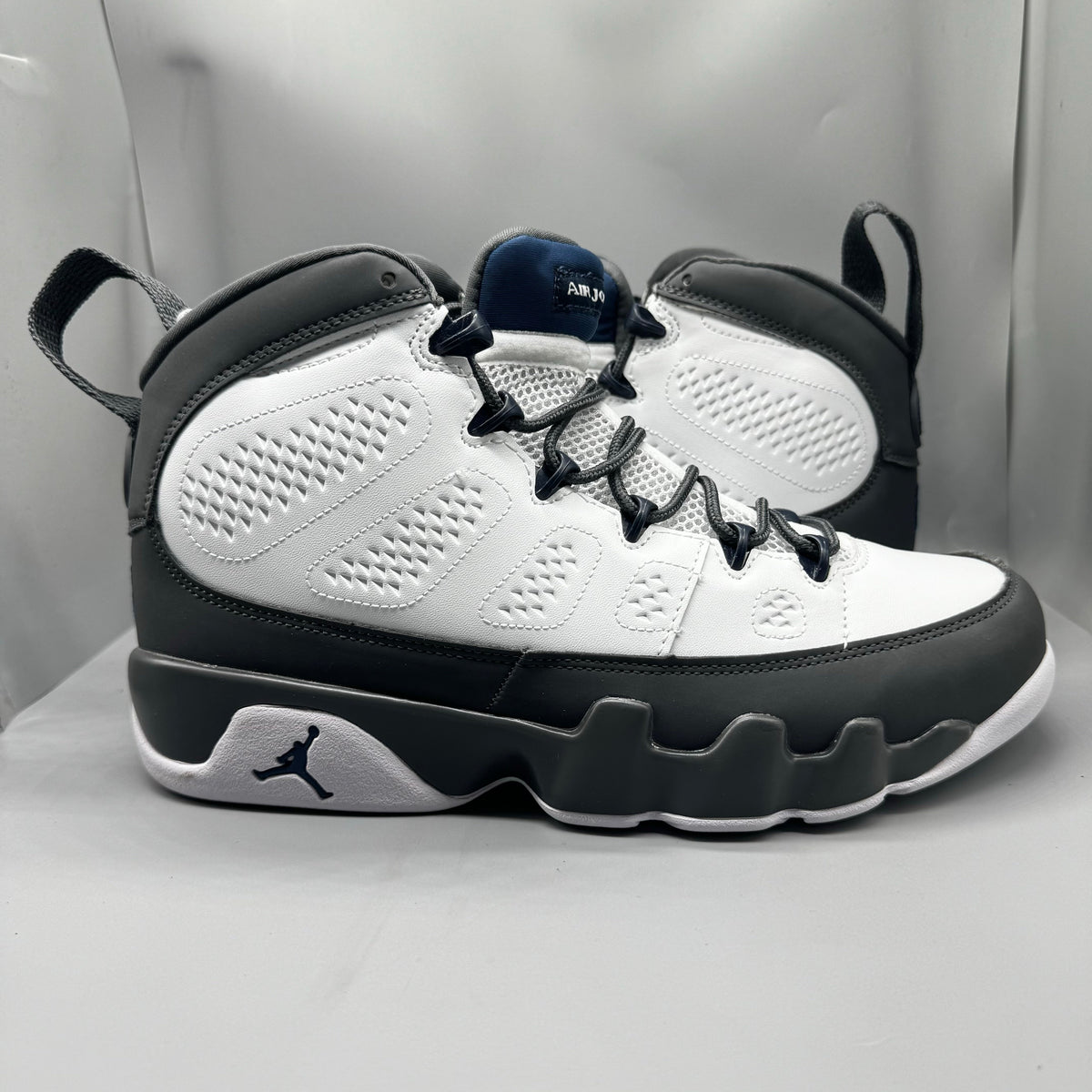 Air Jordan 9 Retro "Flint Grey" sneakers with white, French blue, and Flint grey colors